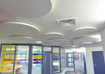 HA/W Acoustic Discs (1200 diameter) installed close to the ceiling to control noise in what was previously a very noisy reception area.